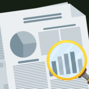 Some papers with words and graphs being inspected under a magnifying glass.